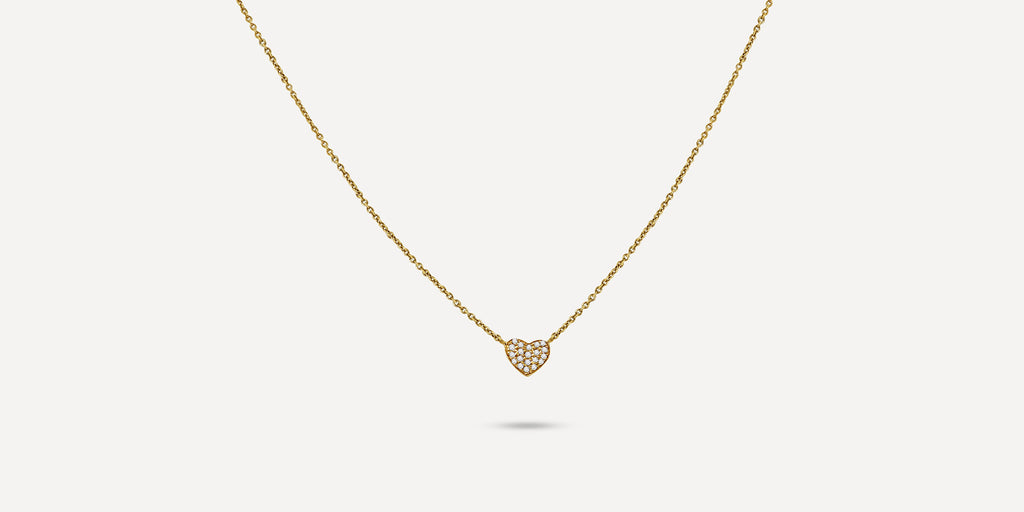 Melee white diamonds on yellow gold heart shaped charm pendant. LIFJ intricate and sweet dainty designs.   Estimated Diamond Weight: 0.08 Carat Of Diamond   Gold Weight: 18K Yllow Gold