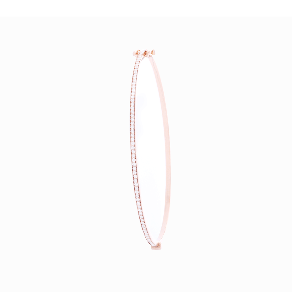 Handcrafted rose gold bangle bracelet embellished with white diamond pavé, wraps gently around the wrist. Perfect for a day to day dress up, complementing tanned skin complexions for ultra-radiance.  Estimated Weight of Diamond: 0.36 carat of diamond Gold Weight: 18k Rose gold
