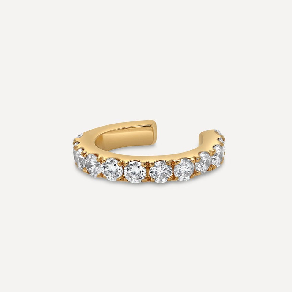Ear cuff alert without any piercings placed on between the cartilage and conch parts of the ear with adorned brilliant-shaped pavé-set white diamonds on yellow gold. Lavish daily assortment.  Estimated Diamond Weight: 0.24 Carat of Diamond Gold Weight: 18K Yellow Gold