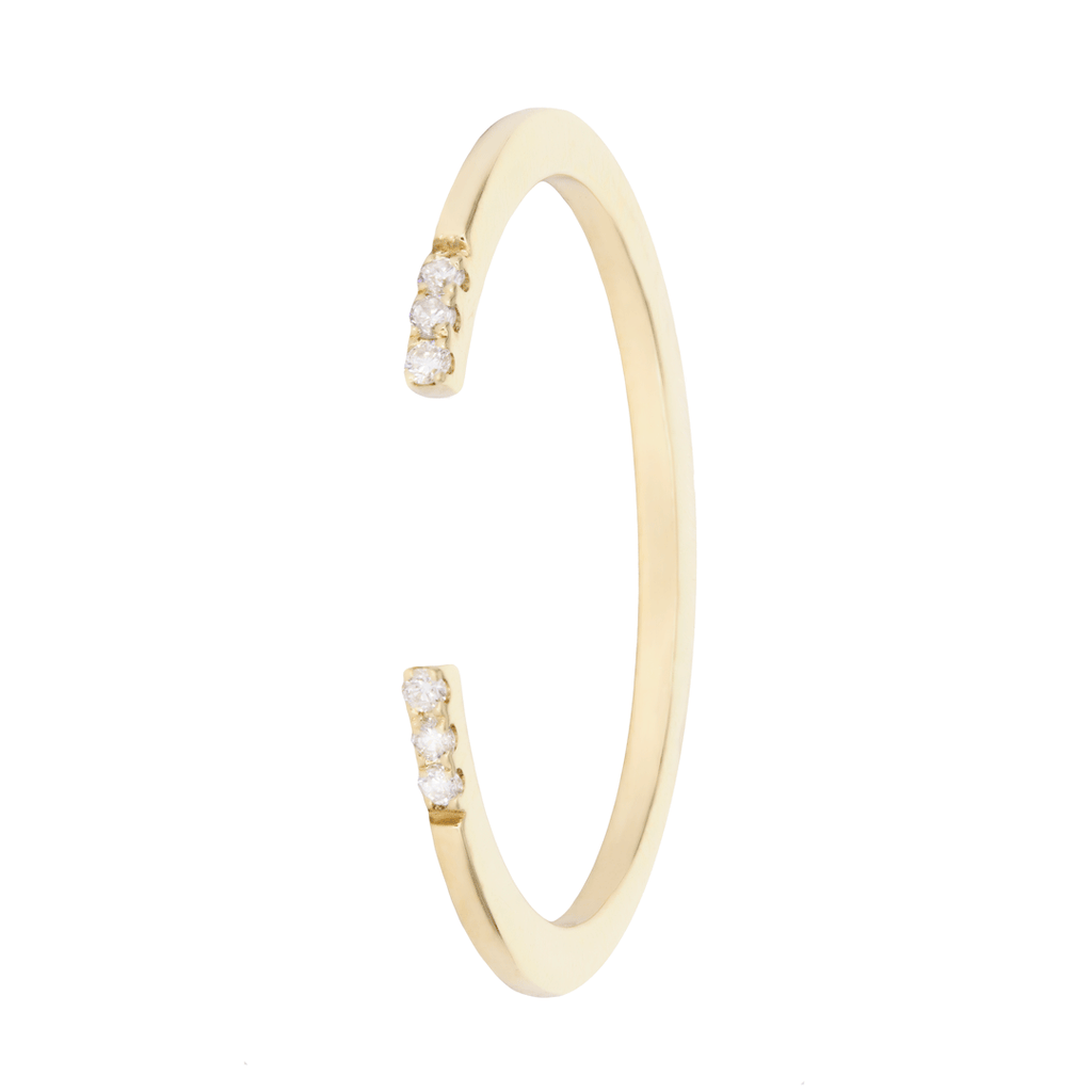 Intricately handcrafted open ring in subtle finesse embellished with six white diamonds set on each side of the yellow gold band. Exceptionally minimalist and contemporary. Your art of stacking comes from within through this piece.  Estimated Diamond Weight: 0.03carat of diamond Gold Weight: 18k Yellow gold